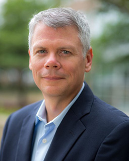 photo a greg jackson, a person wearing a dress suit and sport coat